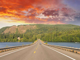 Image showing Beautiful road on the lake with sunset colors