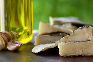 Image showing Codfish, oil and garlic.