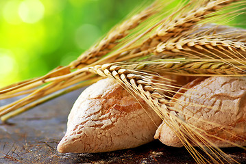 Image showing Portuguese bread and  spikes of wheat.