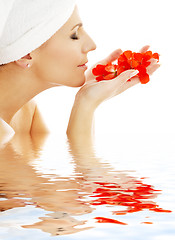 Image showing red petals in water #2