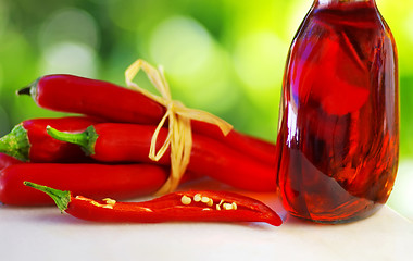 Image showing Red chili and rose wine