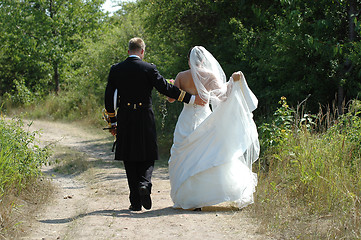 Image showing Wedding couple walking