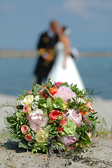 Image showing bouquet, bride and groom