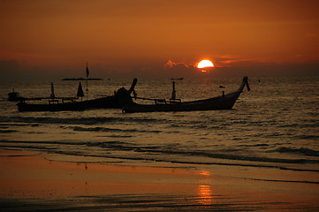 Image showing Sunset and tailboats