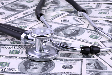 Image showing Stethoscope and dollars