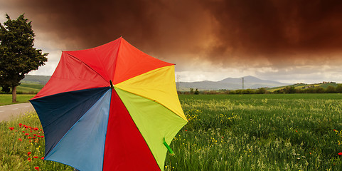 Image showing Tuscany Countryside with Storm and colorful Umbrella