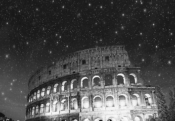 Image showing Colosseum - Rome. Night view with surrounding grass and park