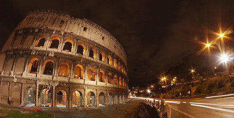 Image showing Colosseum at Night, Rome - Wide Angle view with car light trails