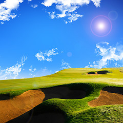 Image showing A photo of a blue sky and a green field 
