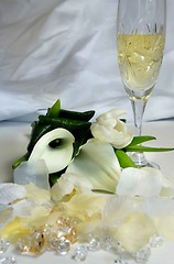 Image showing Beautiful wedding bouquet and glass of champagne 