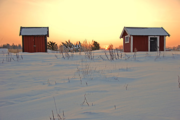 Image showing Red cabins in sunrise