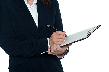 Image showing Cropped image of female secretary taking notes