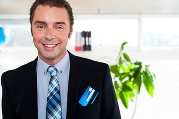 Image showing Handsome business executive smiling at the camera