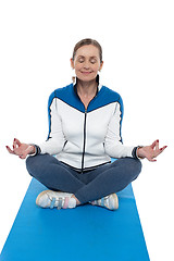 Image showing Portrait of a woman sitting in a lotus position