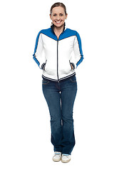 Image showing Stylish woman posing with hands in jackets pocket
