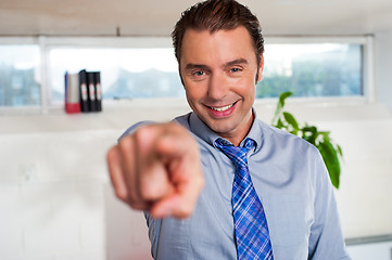 Image showing Handsome man in formals pointing at you