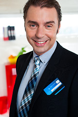 Image showing Cheerful male business executive in formals