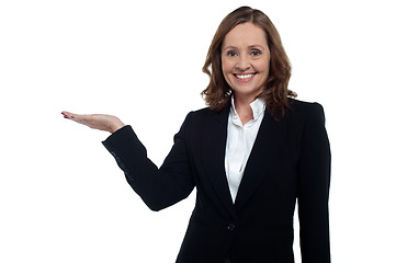 Image showing Middle aged corporate woman showing copy space