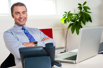 Image showing Confident businessman at his workstation