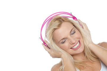 Image showing Tilted shot of a blonde engrossed in music