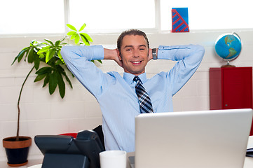 Image showing Manager relaxing in his office, work break