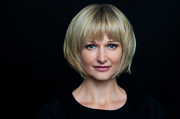 Image showing Blonde woman isolated against black background