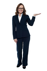 Image showing Woman in business attire posing with an open palm