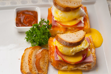 Image showing eggs benedict on bread with tomato and ham