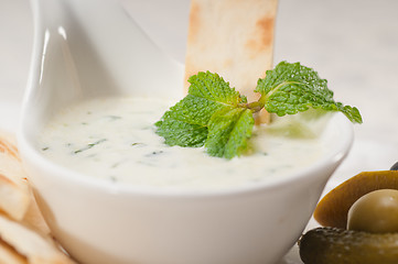 Image showing Greek Tzatziki yogurt dip and pita bread