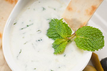 Image showing Greek Tzatziki yogurt dip and pita bread