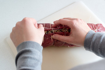 Image showing Preparing a laced beef