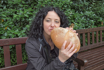 Image showing Girl eating bread