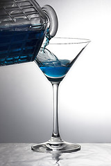 Image showing Pouring a blue drink