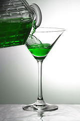 Image showing Pouring a green drink