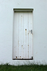 Image showing Neglected Old Rusted White Zinc Door