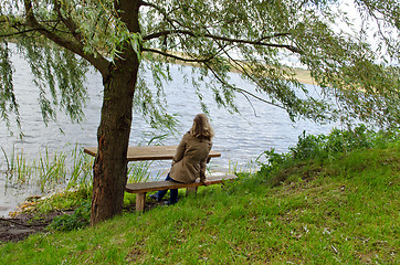 Image showing woman sit wooden bench willow tree admire lake 