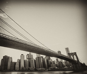 Image showing Upward view of Brooklyn Bridge at Sunset with Manhattan Skyline