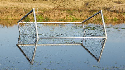 Image showing Football goal in a flooded field