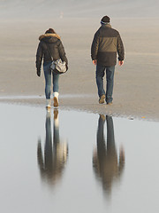 Image showing Couple walking on a dutch beach