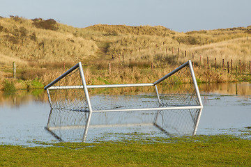 Image showing Football goal in a flooded field