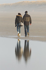 Image showing Couple walking on a dutch beach