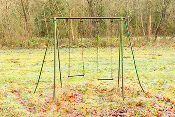 Image showing Old rusted swing 