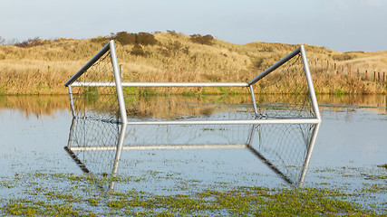 Image showing Football goal in a flooded field