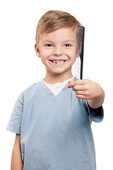 Image showing Boy with comb