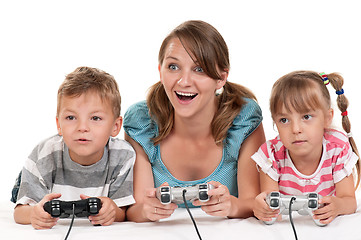 Image showing Happy family playing a video game