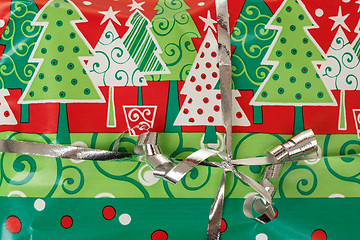 Image showing detail of christmas gift with silver ribbon