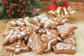 Image showing christmas gingerbreads and decoration on wooden table