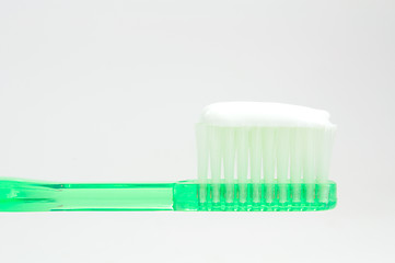 Image showing green toothbrush isolated on white 