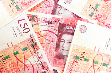 Image showing 50 pound sterling bank notes closeup view business background