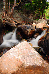 Image showing Waterfall with water flowing around 